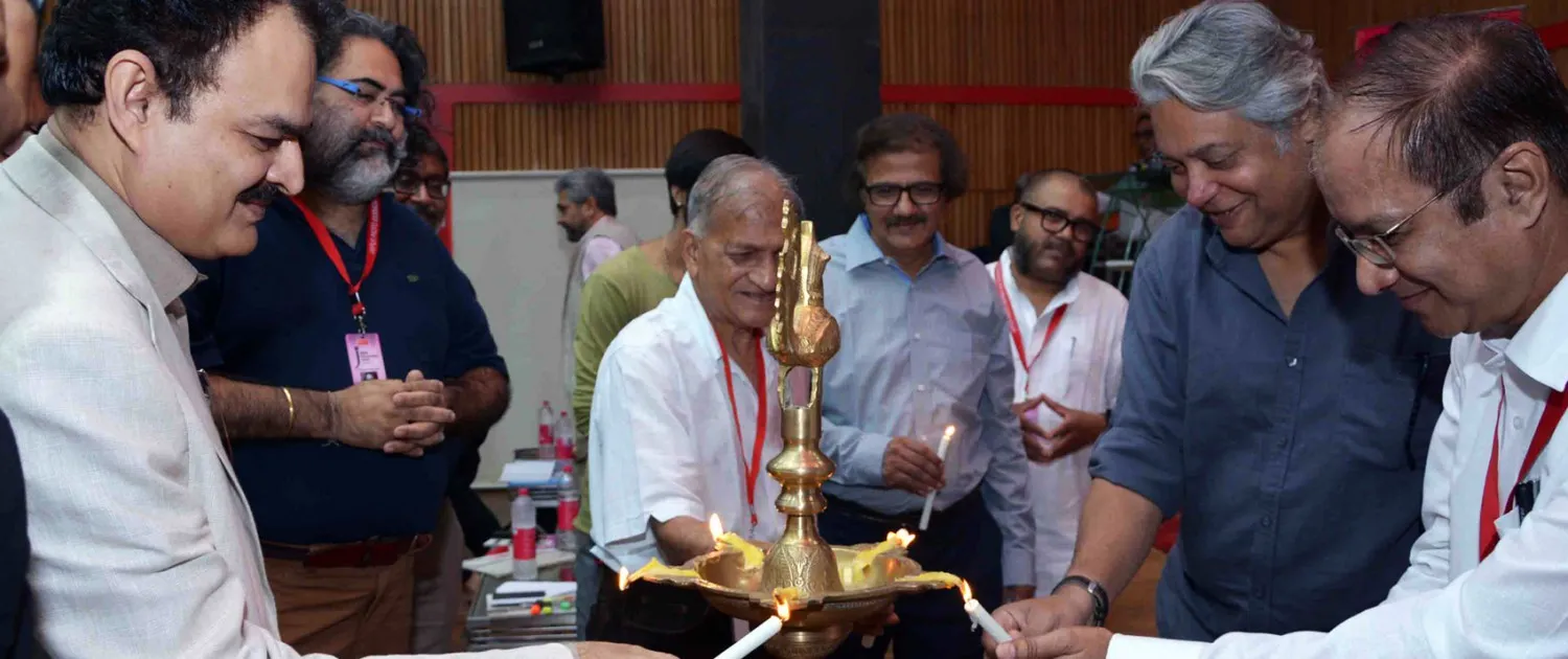 Guests lighting the ceremonial inauguration lamp at the seminar